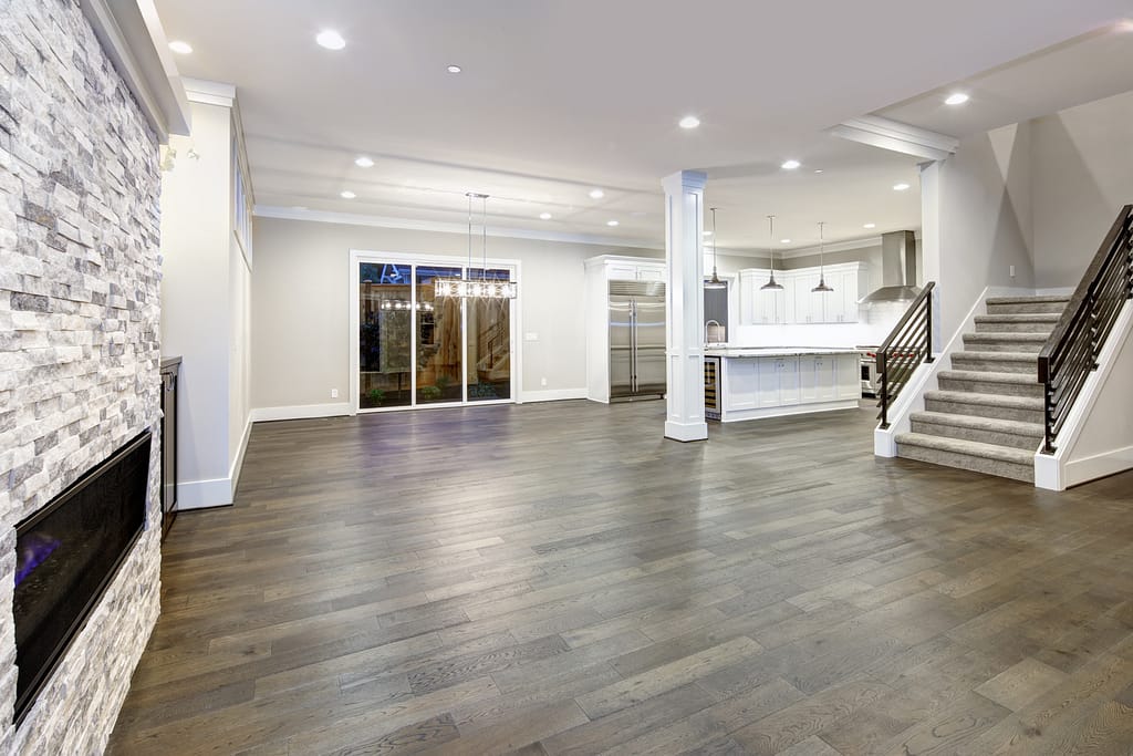 Living room with stone fireplace ceiling with recessed lightening