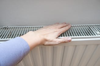 White heating baseboard of a central heating system